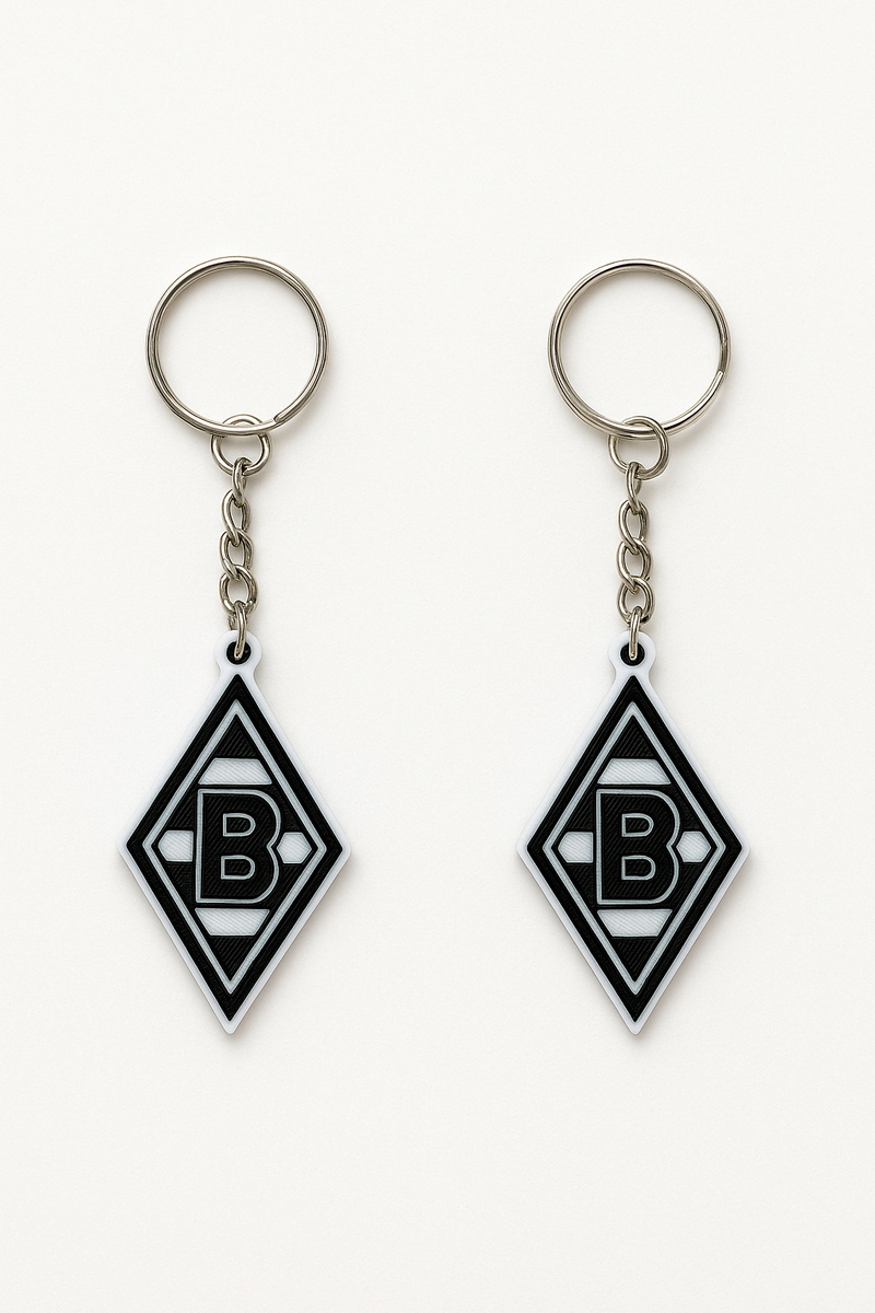 Borussia Mönchengladbach Schlüsselanhänger aus PLA 3D-Druck in Schwarz und Weiß auf hellem Hintergrund