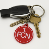 1.FC Nürnberg Schlüsselanhänger auf Tisch mit Autoschlüssel platziert