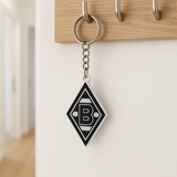 Borussia Mönchengladbach Schlüsselanhänger auf Tisch mit Autoschlüssel platziert