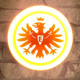 „Runde Lampe mit großem SGE-Adlerlogo vor weißem Hintergrund.“