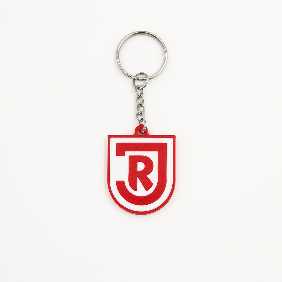 SSV Jahn Regensburg Schlüsselanhänger aus PLA 3D-Druck in Rot und Weiß auf hellem Hintergrund